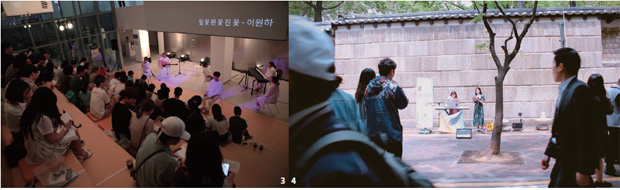 시 낭독자가 덕수궁 돌담길에서 버스킹 공연을 하고 있다. 시 낭독자가 덕수궁 돌담길에서 버스킹 공연을 하고 있다.