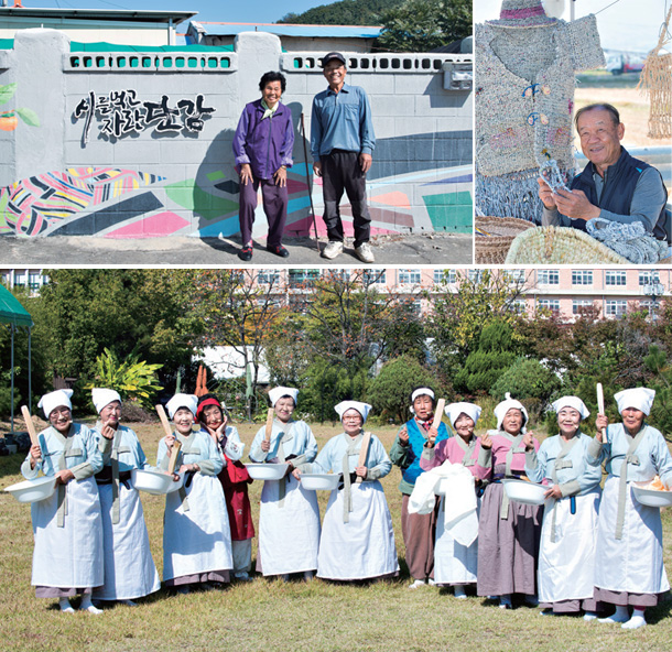 시를 먹고 자란 단감’ 마을인 숭오2리 주민들이 담벼락 앞에 서 있다.