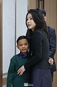 김건희 여사가 31일 서울 용산 대통령실 청사에서 심장질환 수술을 받고 회복 중인 캄보디아 소년 로타와 포옹하고 있다.