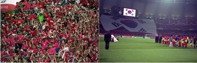 2002년 월드컵 경기의 대형태극기 응원과 열정적인 응원단들의 모습,우린 열정으로 뭉쳤다.(출처= 공감포토,e영상역사관) 2002년 월드컵 경기의 대형태극기 응원과 열정적인 응원단들의 모습,우린 열정으로 뭉쳤다.(출처= 공감포토,e영상역사관)